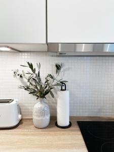 Kuchyň nebo kuchyňský kout v ubytování Seaside Rooms - Zentrales Design-Apartment mit Balkon & Parkplatz - 2 Minuten zum Strand + 16 fotografií