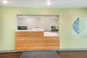 an office with a reception desk in a room at WoodSpring Suites Sulphur - Lake Charles in Sulphur
