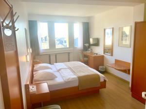 Postel nebo postele na pokoji v ubytování Hotel Francais
