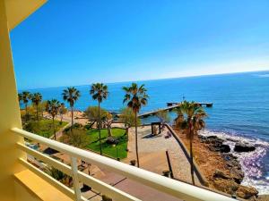 a view of the ocean from a balcony at Villa Margarita in Cala Millor