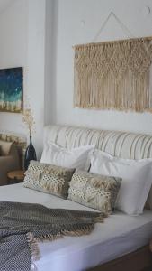 Postel nebo postele na pokoji v ubytování Bungalows Iphigenia