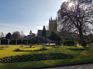 a park with a large building in the background at Old School Apartment 1 First Floor in Bury Saint Edmunds