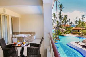 a living room filled with furniture and a pool at Majestic Mirage Punta Cana, All Suites – All Inclusive in Punta Cana