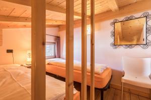 A bed or beds in a room at Ice Chalet 3 Elements