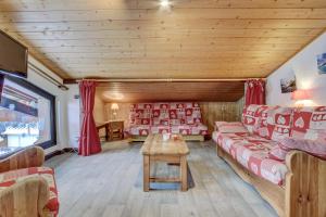 a living room with couches and a table at Atray C3 in Morzine