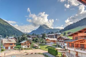 a village with a mountain in the background at Atray C3 in Morzine