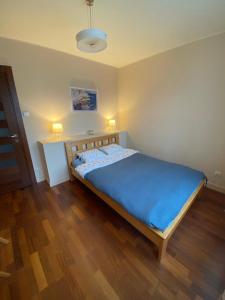 Una cama o camas en una habitación de Apartament Marina Primore 3 pokoje