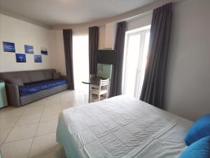 Postel nebo postele na pokoji v ubytování Hotel Oceanomare