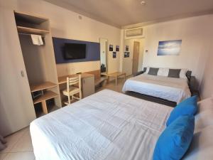 Postel nebo postele na pokoji v ubytování Hotel Oceanomare