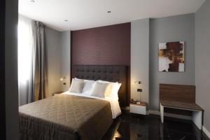 Postel nebo postele na pokoji v ubytování Magri's Hotel
