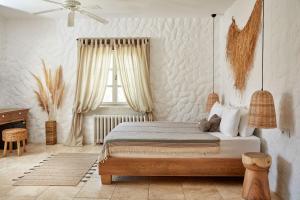 Postel nebo postele na pokoji v ubytování Morro Alacati