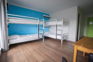 Cama o camas de una habitación en Nyon Hostel
