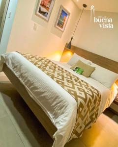 a bedroom with a bed in a room at Hotel Buena Vista in Bucaramanga