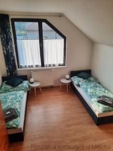 Postel nebo postele na pokoji v ubytování Penzion U Mnicha