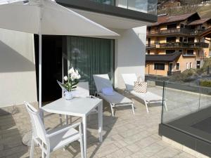 Balkón alebo terasa v ubytovaní Dolomeet Boutique Hotel