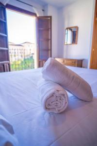 Кровать или кровати в номере Apartamento Balcones del Tajo