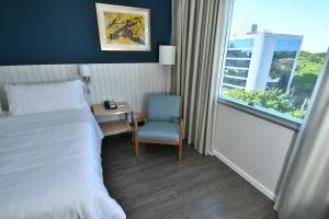 Voodi või voodid majutusasutuse Holiday Inn Express Asuncion Aviadores by IHG toas