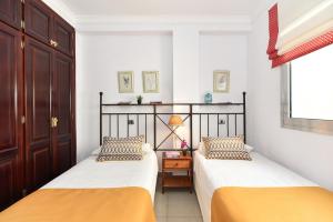 Posteľ alebo postele v izbe v ubytovaní Luxury BeachFront Mogan