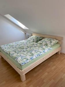 a bed in a room with a bed frame at Apartment – Wohnung bei Nürnberg #2 in Röthenbach an der Pegnitz