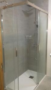 a shower with a glass door in a bathroom at La Linea in Puerto de Mazarrón