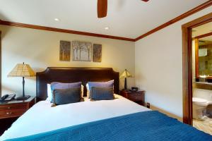 Кровать или кровати в номере Lion Square Lodge South 650