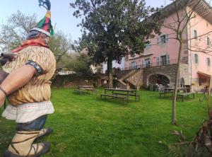 a statue of a person in a park at Tresanea Apartamentos in Ituren