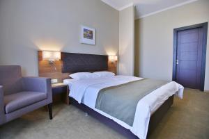 Postel nebo postele na pokoji v ubytování Tskaltubo Plaza Hotel