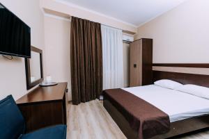 Un pat sau paturi într-o cameră la AMIGO Panna-Cotta