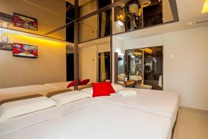 Postel nebo postele na pokoji v ubytování Time Hotel Sunway