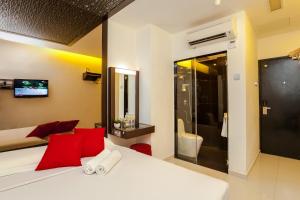 Postel nebo postele na pokoji v ubytování Time Hotel Sunway
