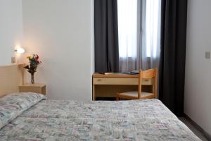 Postel nebo postele na pokoji v ubytování My Place Hotel