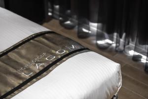 Postel nebo postele na pokoji v ubytování Hotel YAM LAGOM