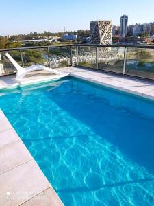 a swimming pool on the roof of a building at Soul y Río in Córdoba