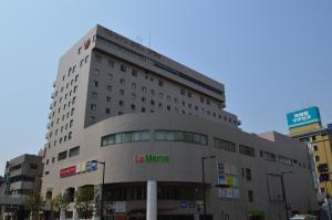 a large building with the words la korea at Takasaki Washington Hotel Plaza in Takasaki
