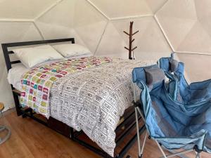 Katil atau katil-katil dalam bilik di Glamping Naturaleza - mirador de la laguna de suesca