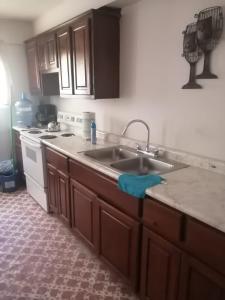 a kitchen with a sink and a counter top at Brenda Alicia 2 in Puerto Peñasco