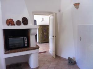 A television and/or entertainment centre at Villa Trullo di Angela