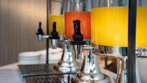 a row of glasses sitting on top of a counter at Holiday Inn Shanghai Nanjing Road by IHG in Shanghai