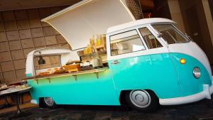 a blue and white food truck parked in a room at Holiday Inn Shanghai Nanjing Road by IHG in Shanghai