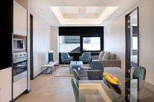 a living room with a couch and a table at City Explorer - 704 in Cape Town