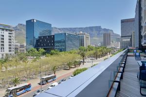 a view of a city with buses on a street at City Explorer - 704 in Cape Town