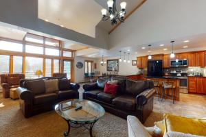 a large living room with couches and a table at Lion Square Lodge East 310A in Vail