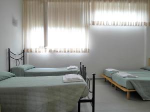 ​​唐卡拉布里亚卡萨费里歌剧院酒店客房内的一张或多张床位