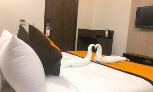 Letto o letti in una camera di Hotel Aksh Inn
