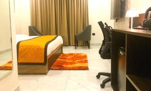 Letto o letti in una camera di Hotel Aksh Inn