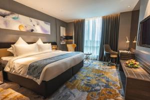 Postel nebo postele na pokoji v ubytování Ames Hotel