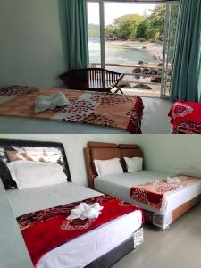 سرير أو أسرّة في غرفة في Mr. Bean Resort