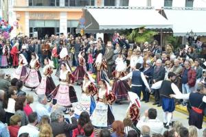a group of people dancing in front of a crowd at Archontiko ''Danae'' in Lefkimmi