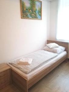 Postel nebo postele na pokoji v ubytování szt.flórián