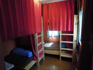Postel nebo postele na pokoji v ubytování Bellscabin Guesthouse